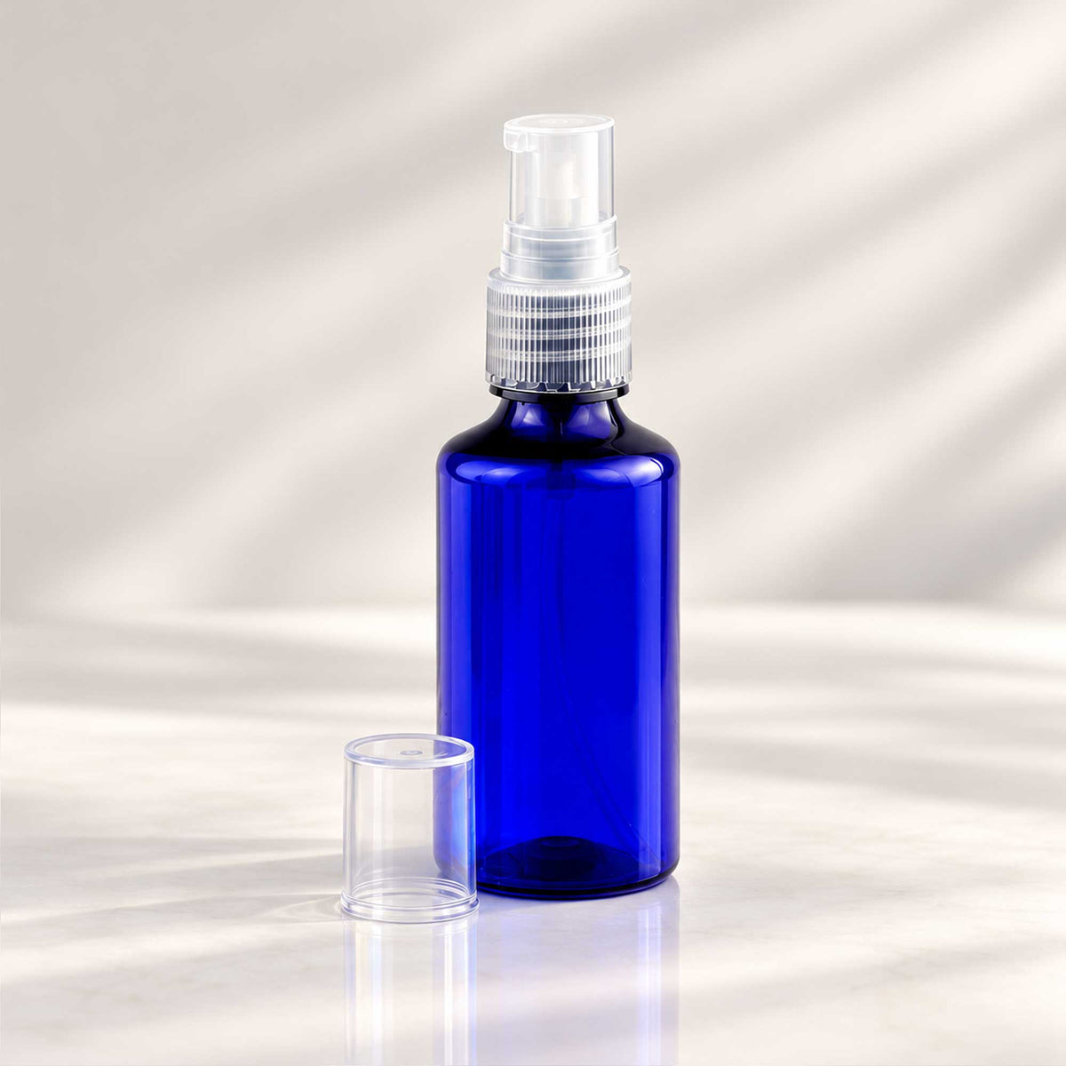 Plava PET bočica 50 ml sa transparentnom gel-serum pumpicom, grlo 18 mm - 413400 - 425120 | Bazika