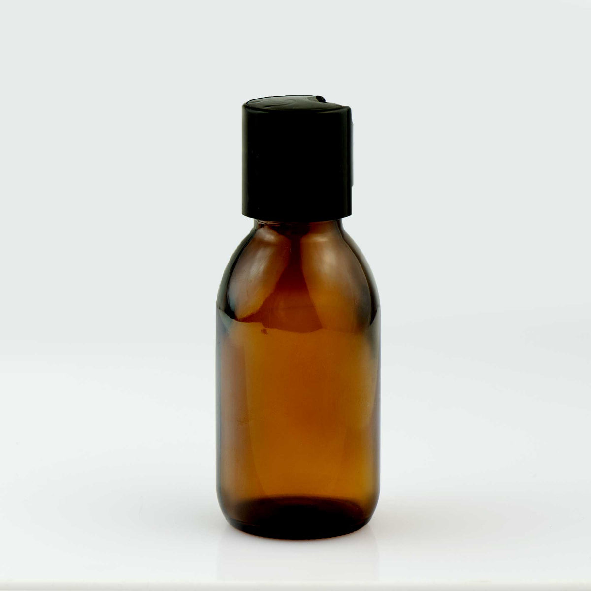 Braon staklena boca za sirup 100 ml, grlo 28 mm, sa crnim disk top poklopcem - 441180, 448310 | Bazika
